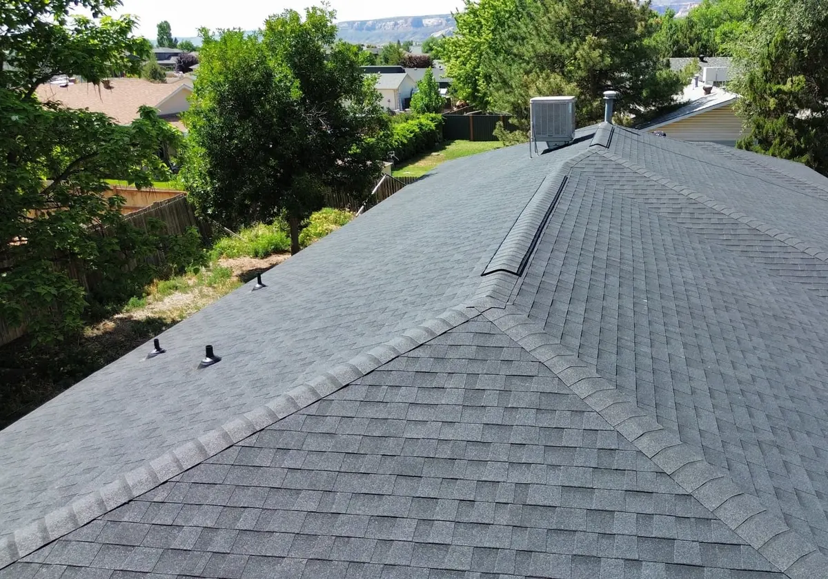 New ridge cap running the length of the finished roof