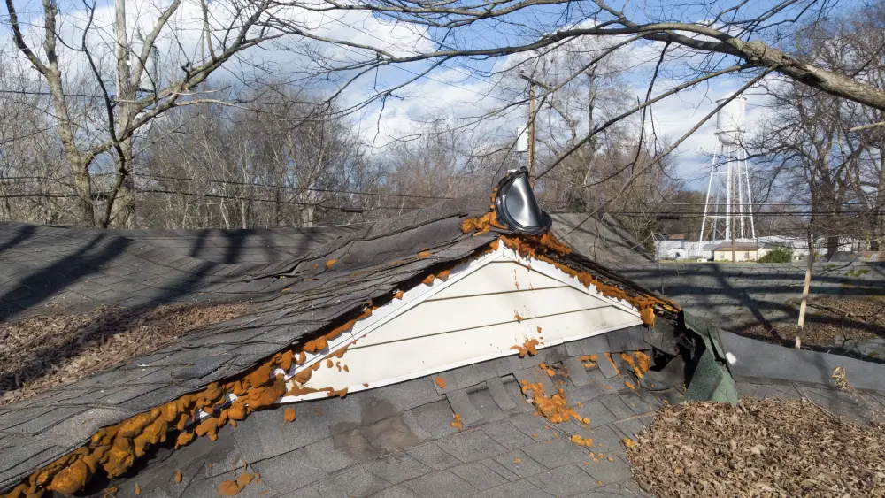 An aging roof with a visibly sagging, wavy ridgeline